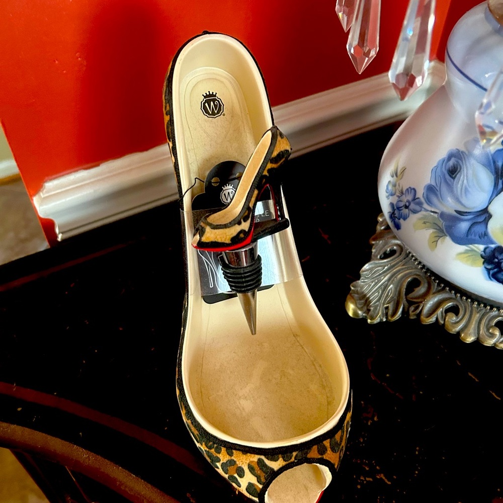 Wine holder and bottle stopper